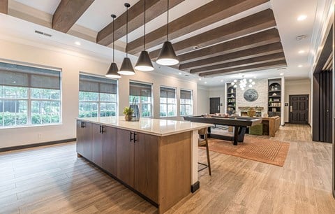 a large kitchen with a large island and a pool table